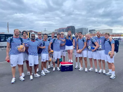 Photo of Olympic Men's team with Rachael Mack